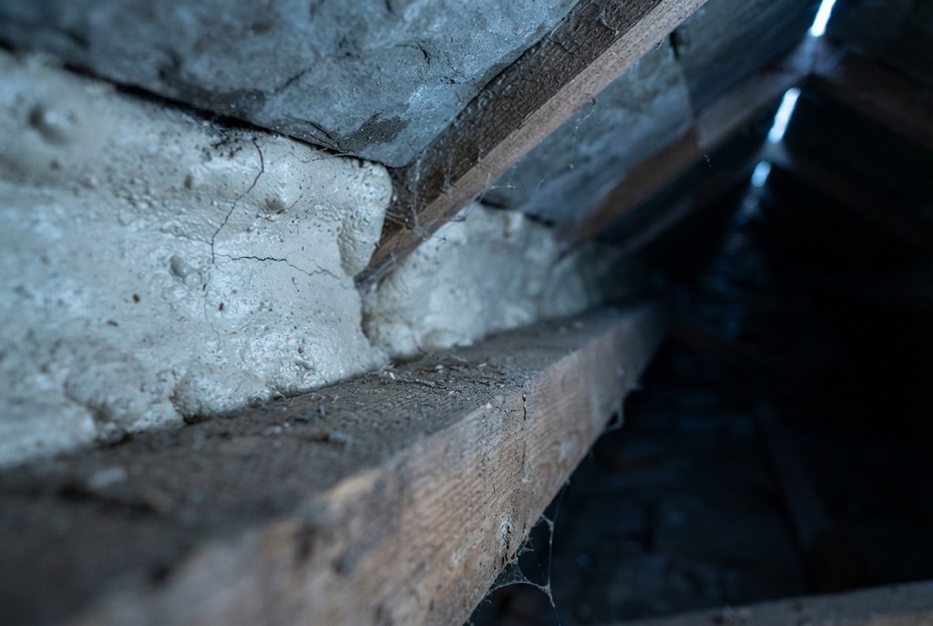 Foam bonded to roof tiles in a Oldham terrace.